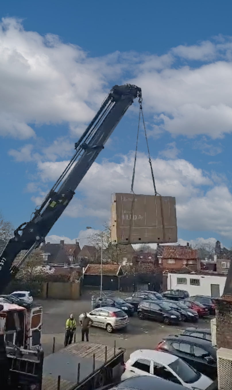 a television being pulled by a crane